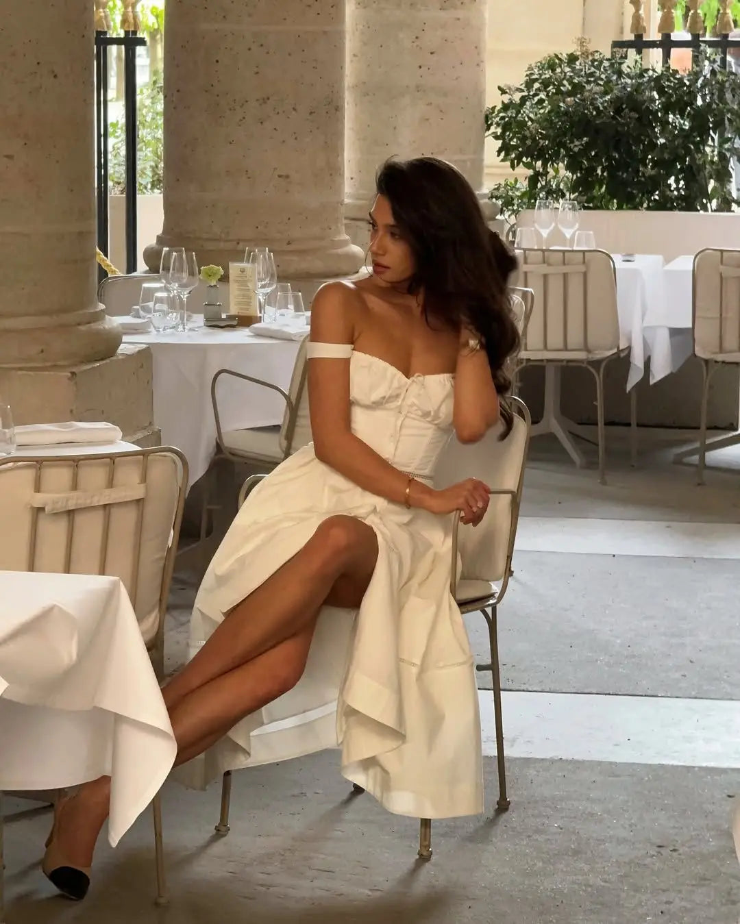 Elegant sleeveless white summer dress with A-line silhouette