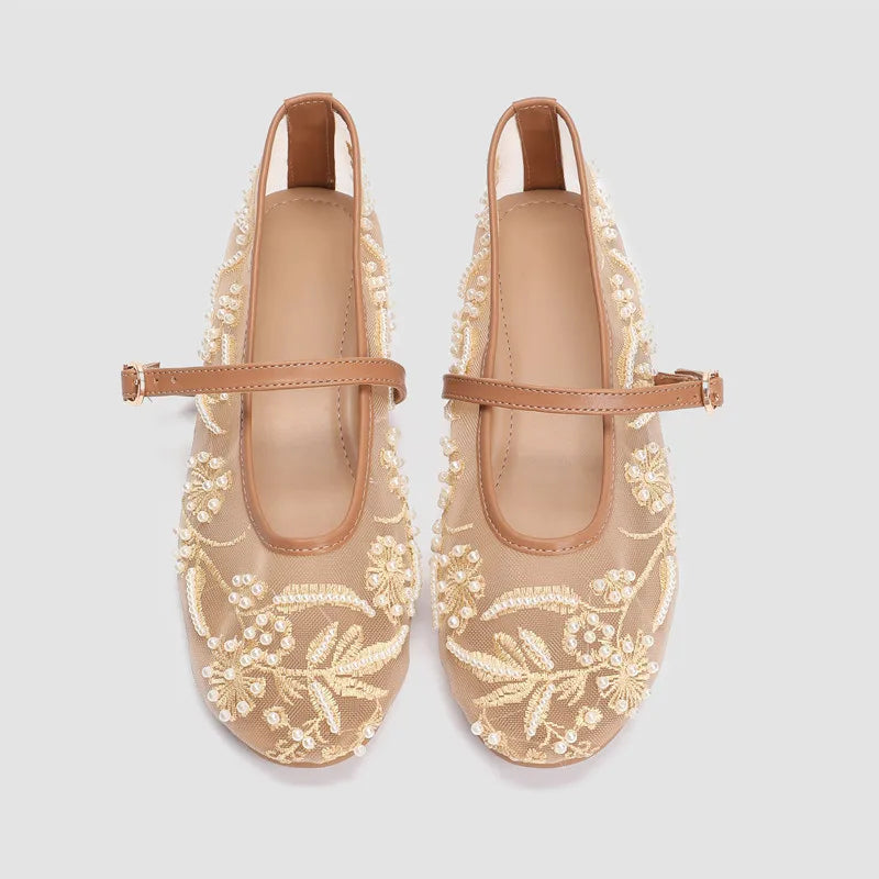 Side view of apricot mesh ballet flats with delicate beaded details and adjustable strap.