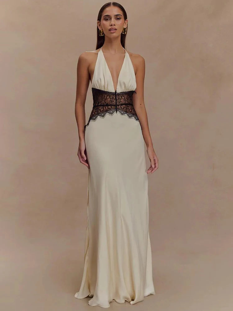Elegant sleeveless maxi dress with deep V-neckline, black lace waist detail, backless design and flowing hem in white color – summer evening gown