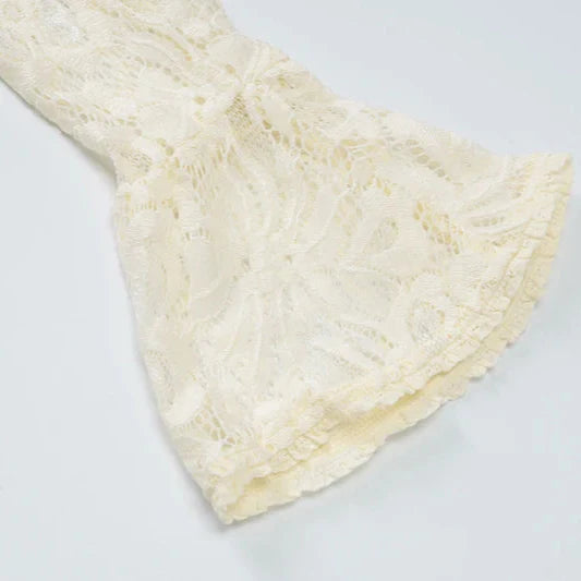 White lace fabric on a light gray background