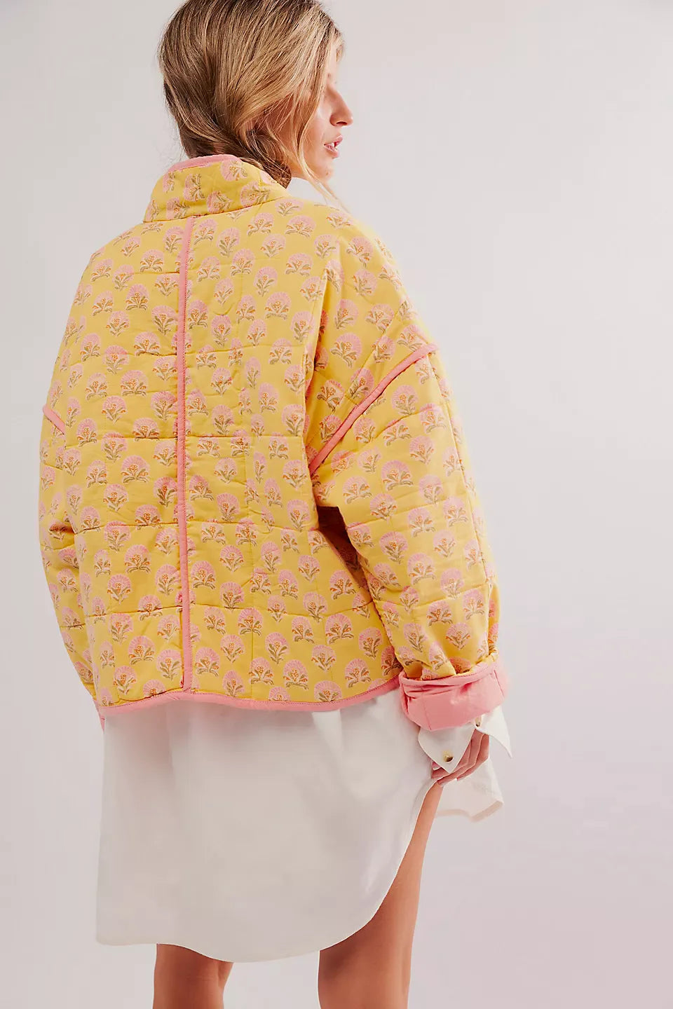 Side view of printed yellow quilted cotton jacket for women