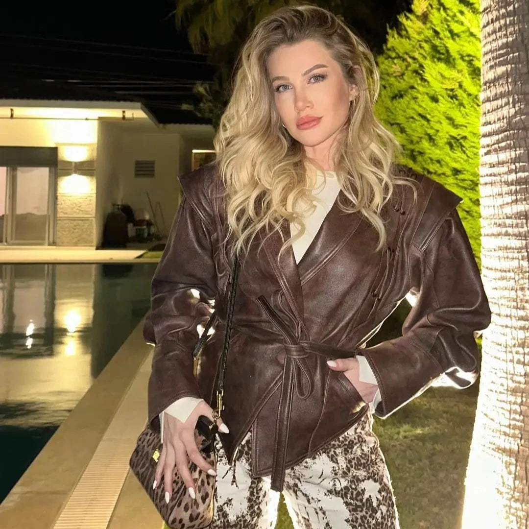 Woman in a brown leather jacket trendy