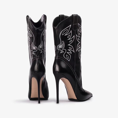 Black cowboy boots with high heels pointed toe and embroidery detail on denim stiletto high heel boots