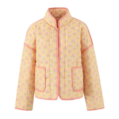 Yellow jacket with pink floral pattern on a white background