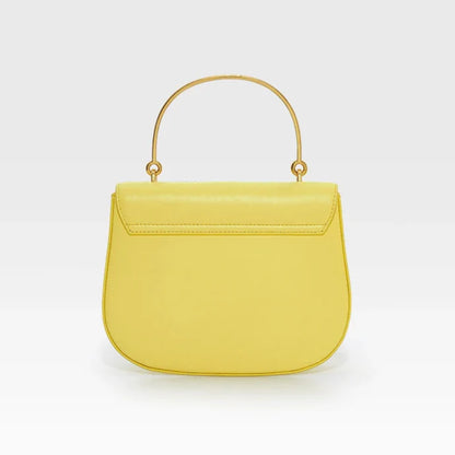 Yellow handbag with gold handle on a white background, featuring the brand 'Bafelli'.