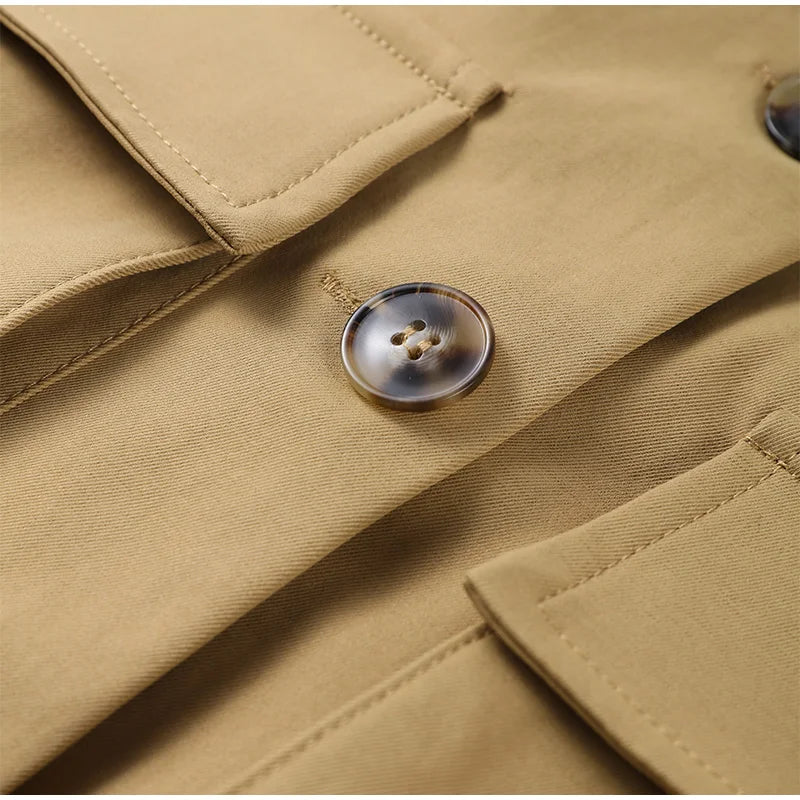 Close-up of a beige coat with a button