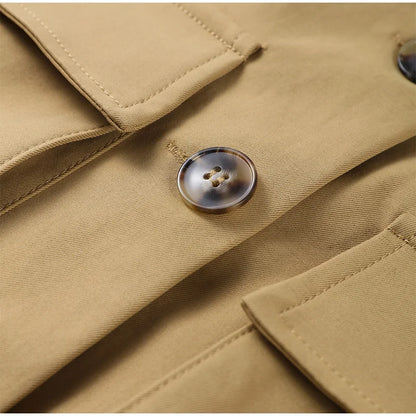 Close-up of a beige coat with a button