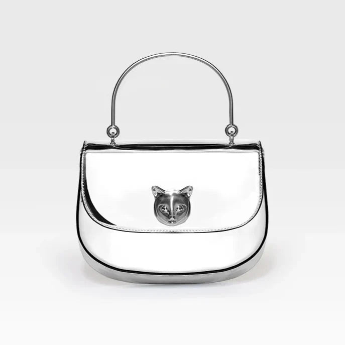 Silver handbag with a cat face emblem on a white background, featuring the brand 'Bafelli'.