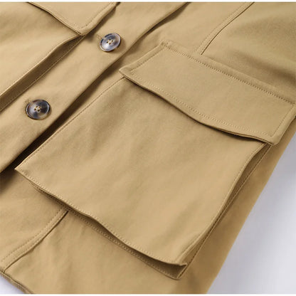 Close-up of a beige jacket with button details on a white background