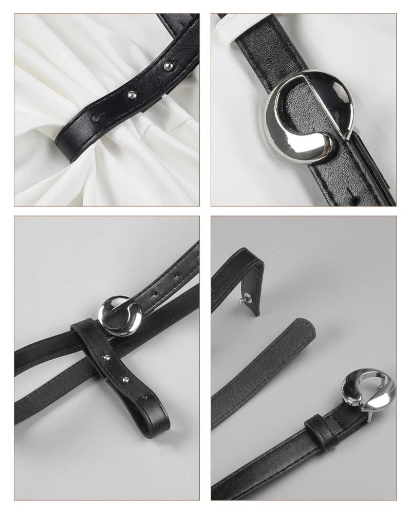 Black leather belt with silver buckle on a white background