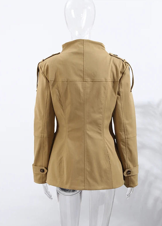 Beige jacket on a mannequin against a white background