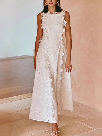 White sleeveless midi dress with floral embroidery and lace-up waist detail