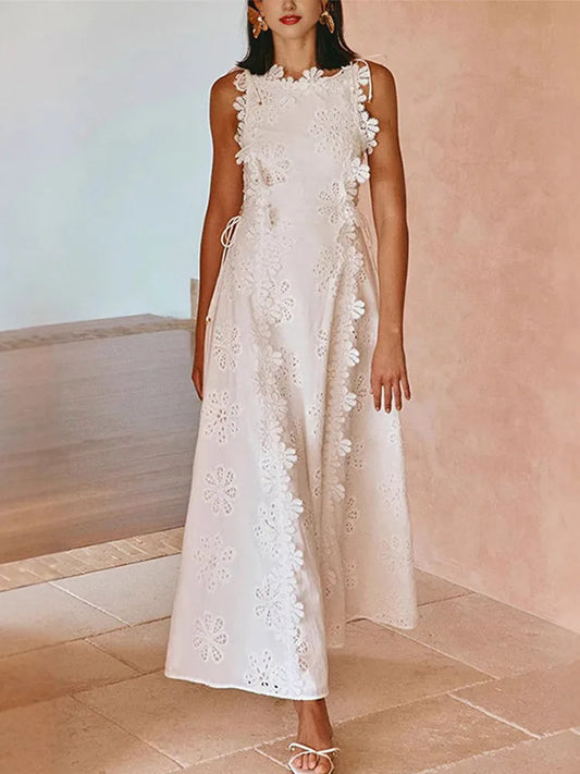 White sleeveless midi dress with floral embroidery and lace-up waist detail