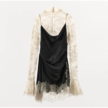 Black dress with lace overlay on a white background