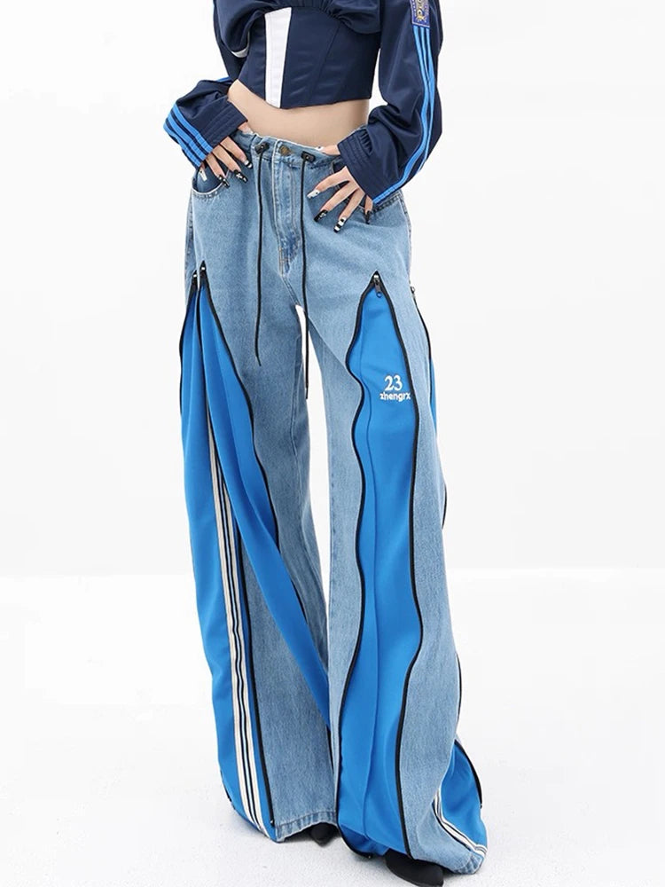 Wide leg denim trousers with bold red side zippers