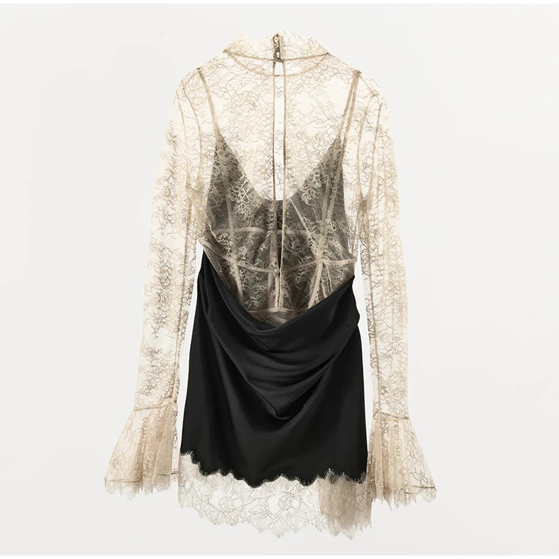 Lace top with a black drape over a white background