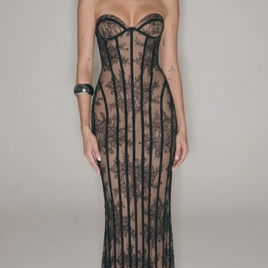 Black sheer lace corset maxi dress with strapless neckline, bodycon fit, and see-through floral lace design for evening